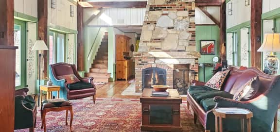The Old Orchard Home surrounded by a small apple orchard, large meadows, and a private pond