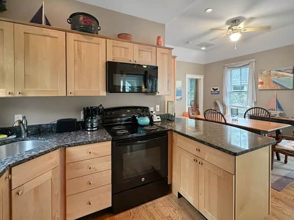 Seaglass Village Unit 182: 2BR in Wells, featuring a King bed and bunk beds for 4 guests.